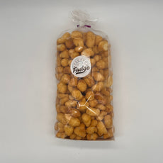 Transparent bag filled with crunchy Krazy Korn popcorn mix, showcasing a sweet caramel glaze, perfect for sharing.